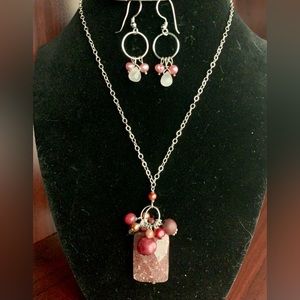 Artisan, silver, and semi precious pink stone necklace and earring set.